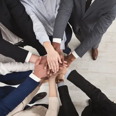 Real Estate Agents Team Hands Together